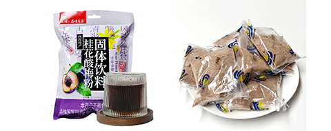 红枣糕产品包装正面图,方形纸盒包装,印有红枣图案,背景为木质桌面